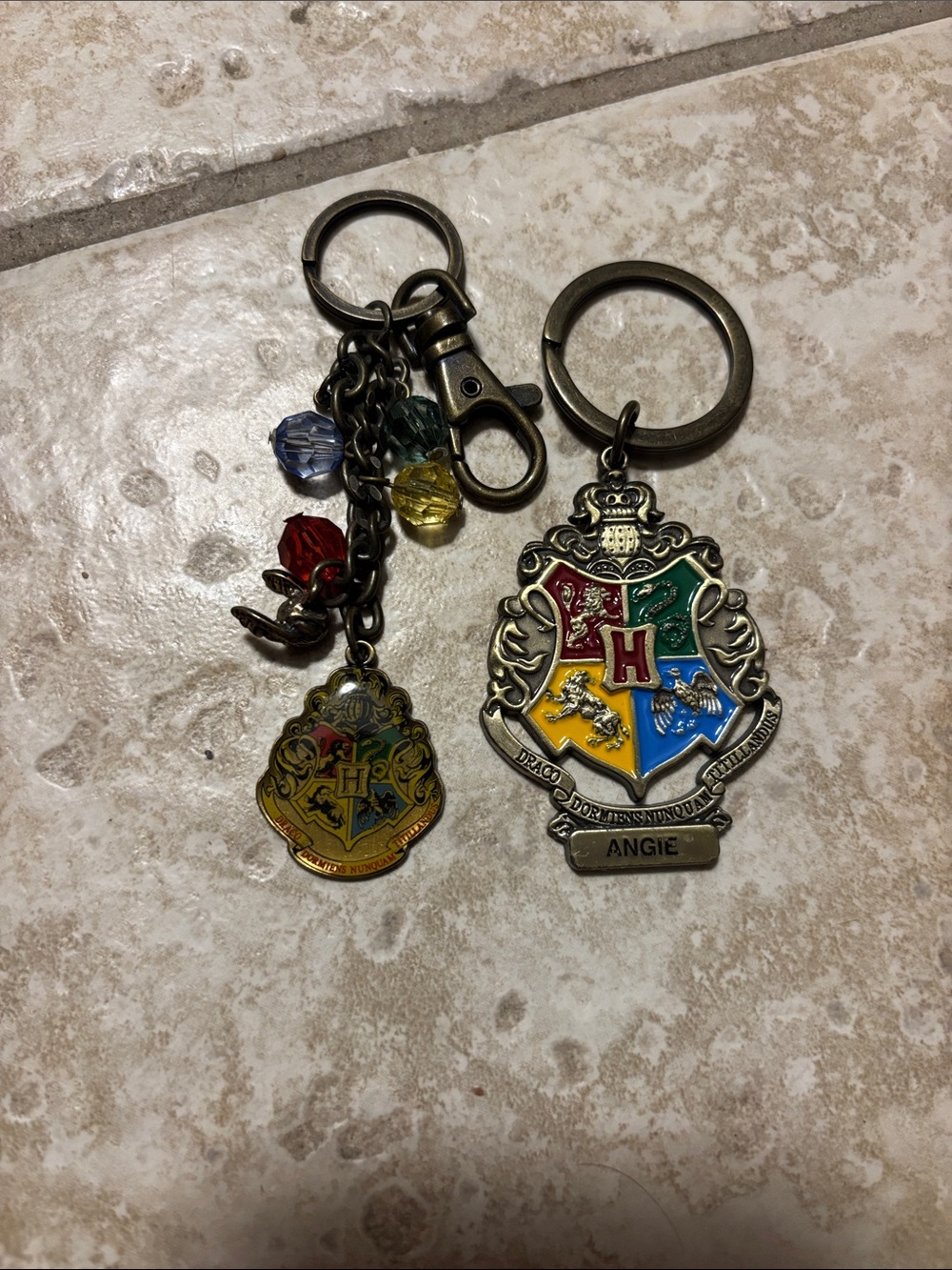 Harry Potter keychains one says Angie on it both in good condition